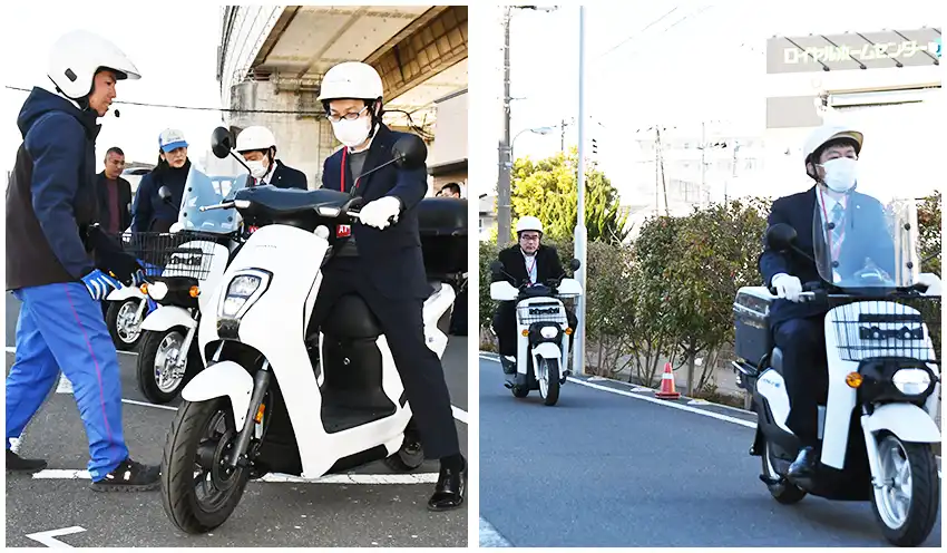 信金中金が三菱オートリースと連携して開いたイベントで、電動バイクを試乗する都内信金職員ら（2月25日）