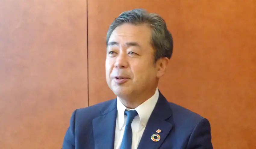銀行などとの取り組みを話す高田新協会長
